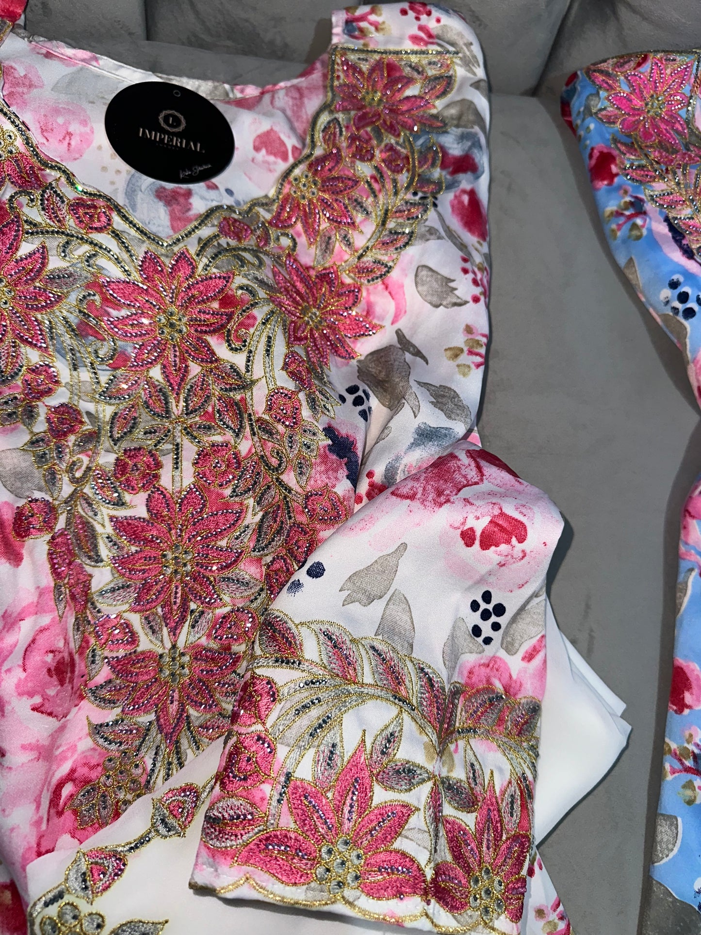 Dark blue, white, blue and pink mkhawars with matching Shiela