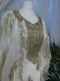 Gold and white Emirati and Arabic dress